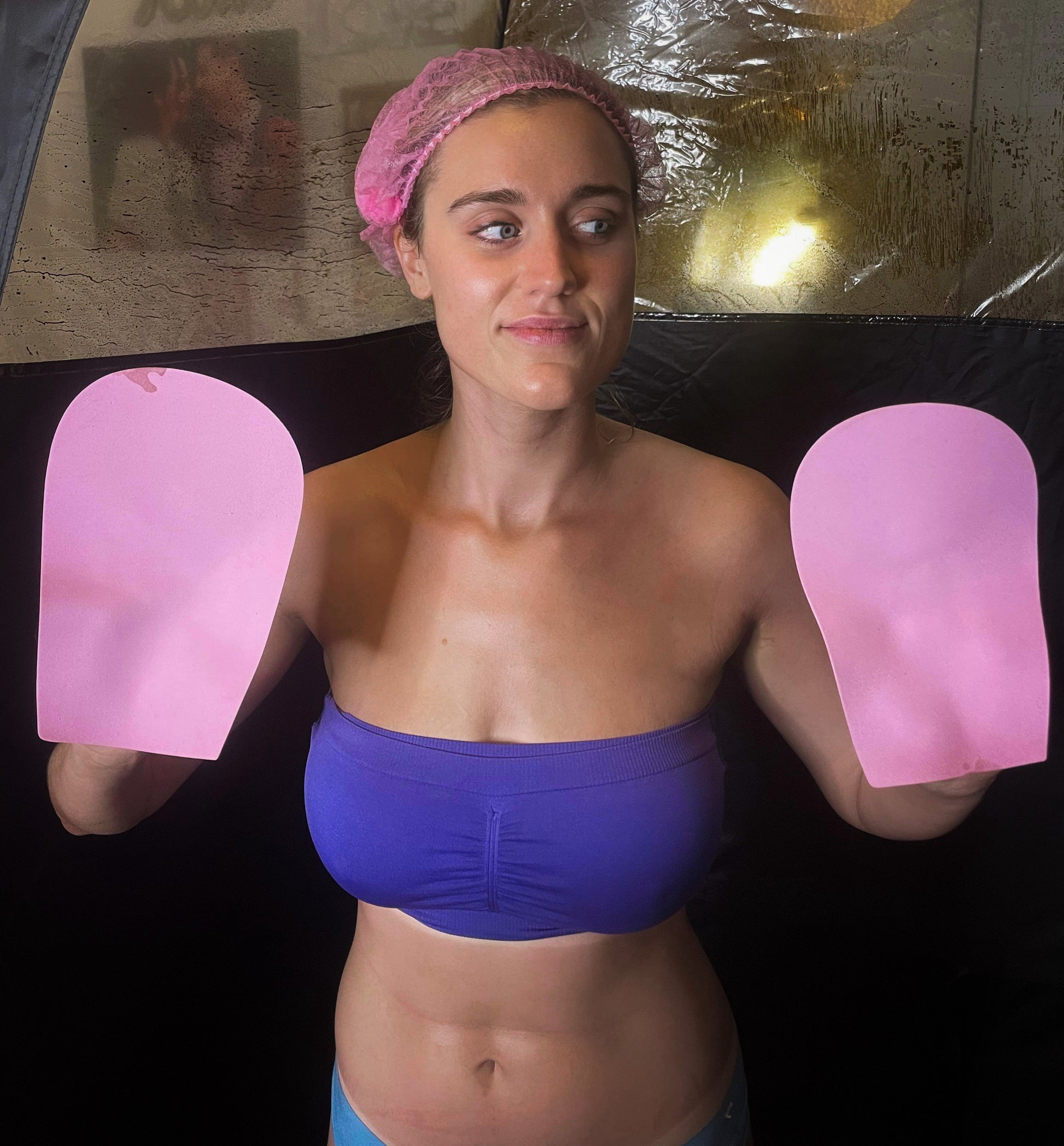 Glo'guard hands on client during spray tan
